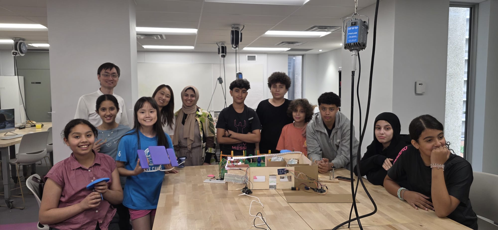 The full group of HIVE Makers Summer Camp students and instructors together at the OISE makerspace